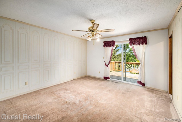 14050 Shannon Dr, Cement City, MI 49233 - empty room featuring carpet flooring, a ceiling fan, a textured ceiling, and ornamental molding