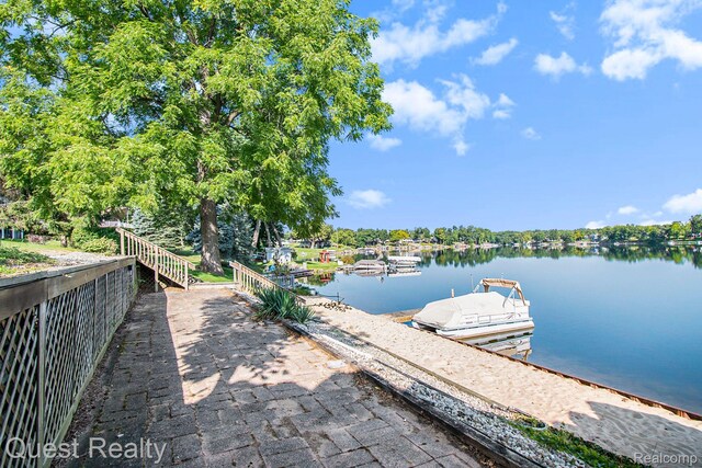 14050 Shannon Dr, Cement City, MI 49233 - dock area featuring a water view and view of wooded area