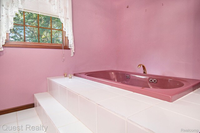 14050 Shannon Dr, Cement City, MI 49233 - bathroom with a bath and tile patterned flooring