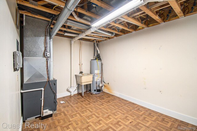 14050 Shannon Dr, Cement City, MI 49233 - unfinished below grade area with water heater and heating unit