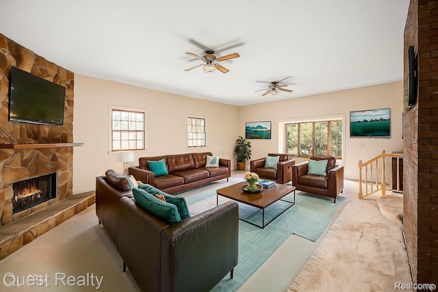 14050 Shannon Dr, Cement City, MI 49233 - living room with a fireplace, plenty of natural light, and a ceiling fan
