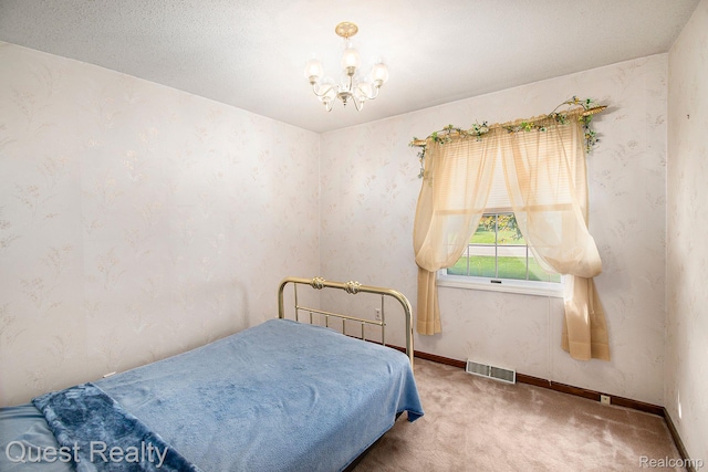 14050 Shannon Dr, Cement City, MI 49233 - carpeted bedroom featuring a chandelier and wallpapered walls