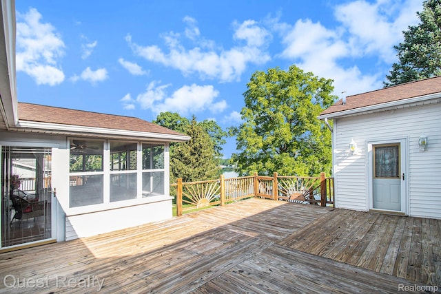 14050 Shannon Dr, Cement City, MI 49233 - wooden deck with a sunroom