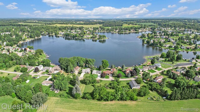 14050 Shannon Dr, Cement City, MI 49233 - aerial view of property and surrounding area featuring a nearby body of water and nearby suburban area