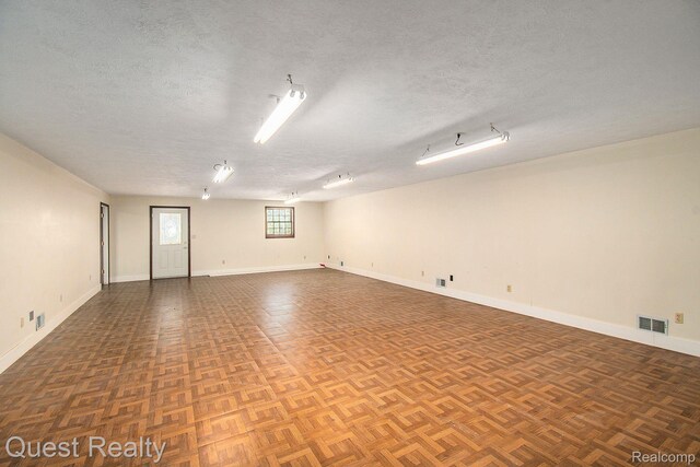 14050 Shannon Dr, Cement City, MI 49233 - spare room with a textured ceiling