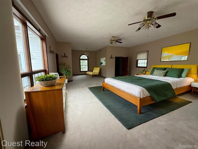14050 Shannon Dr, Cement City, MI 49233 - bedroom with concrete flooring and ceiling fan