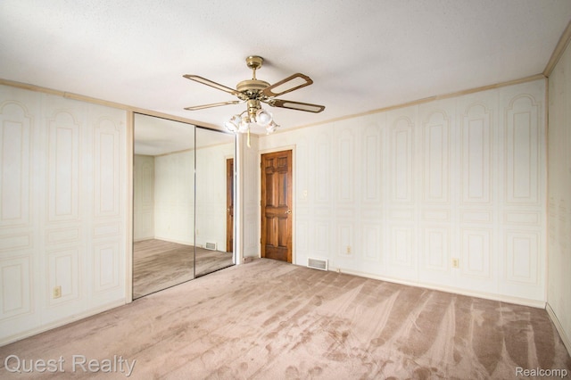 14050 Shannon Dr, Cement City, MI 49233 - unfurnished bedroom with carpet flooring, ornamental molding, and a ceiling fan