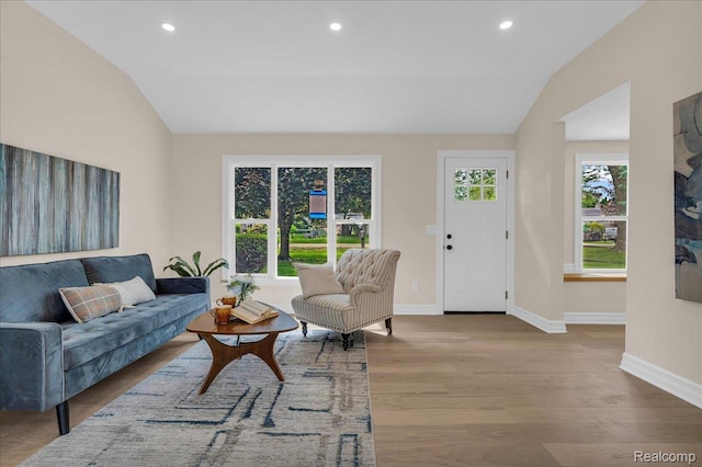 27853 Johnson Rd, Grosse Ile, MI 48138 - living room featuring lofted ceiling, wood finished floors, and recessed lighting