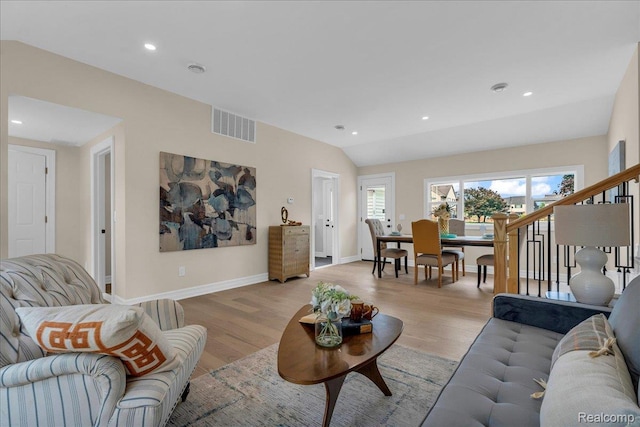 27853 Johnson Rd, Grosse Ile, MI 48138 - living area with light wood finished floors, recessed lighting, stairway, and vaulted ceiling