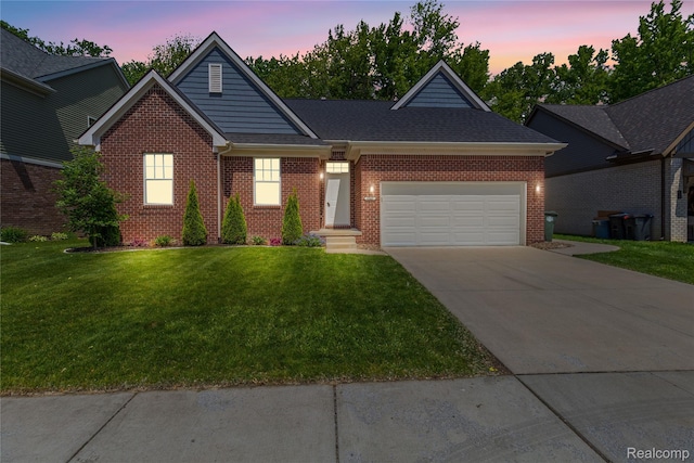 47467 Bayside Cir W, Chesterfield, MI 48047 - view of front of home with a garage, concrete driveway, a yard, and brick siding