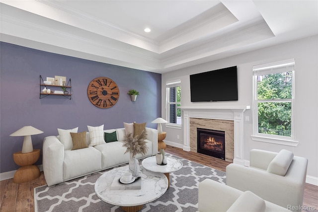 47467 Bayside Cir W, Chesterfield, MI 48047 - living area with wood finished floors, ornamental molding, healthy amount of natural light, a glass covered fireplace, and recessed lighting
