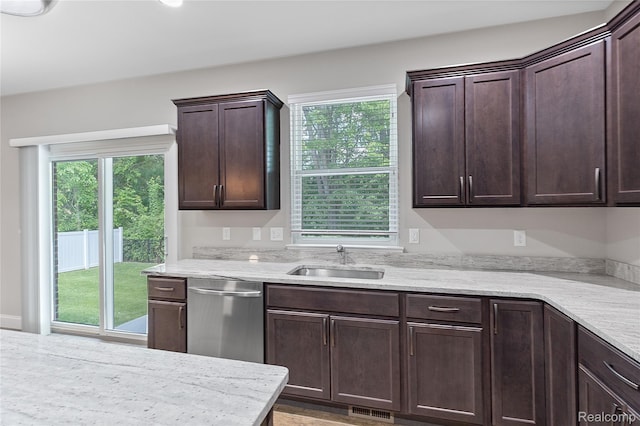47467 Bayside Cir W, Chesterfield, MI 48047 - kitchen with stainless steel dishwasher, dark brown cabinets, and light stone countertops