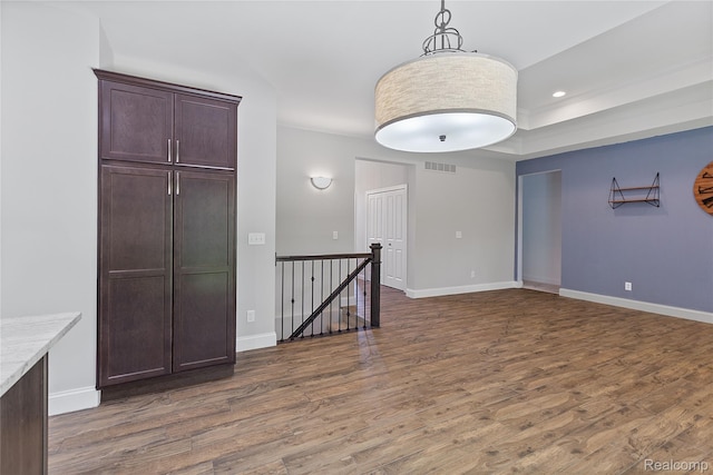 47467 Bayside Cir W, Chesterfield, MI 48047 - unfurnished room featuring wood finished floors, recessed lighting, and a tray ceiling