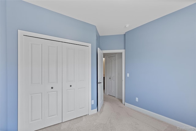 47467 Bayside Cir W, Chesterfield, MI 48047 - unfurnished bedroom featuring light carpet and a closet