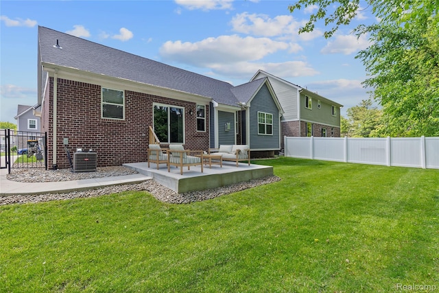 47467 Bayside Cir W, Chesterfield, MI 48047 - rear view of house with brick siding, a patio, an outdoor living space, and roof with shingles