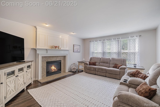 894 Canyon Creek Dr, Holly, MI 48442 - living room with dark wood finished floors and a tiled fireplace