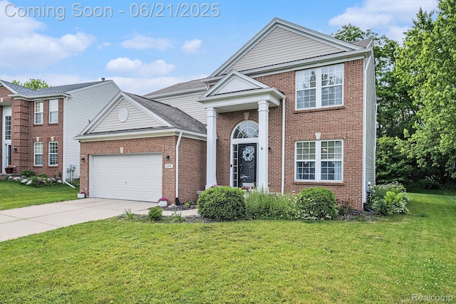 894 Canyon Creek Dr, Holly, MI 48442 - view of front of house with a garage, brick siding, concrete driveway, and a front lawn