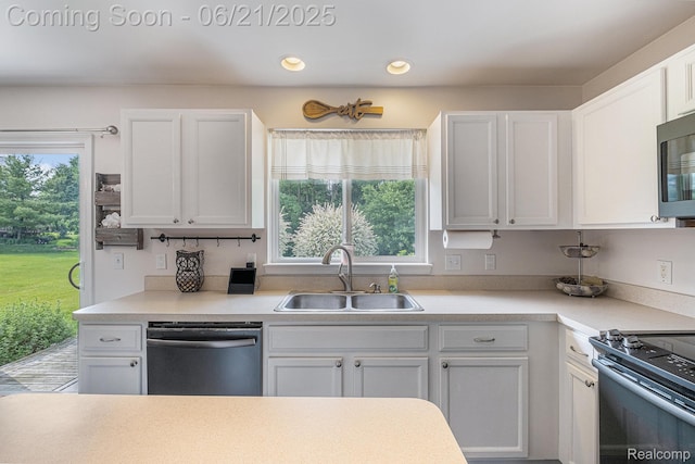 894 Canyon Creek Dr, Holly, MI 48442 - kitchen featuring dishwasher, white cabinets, stove, light countertops, and recessed lighting