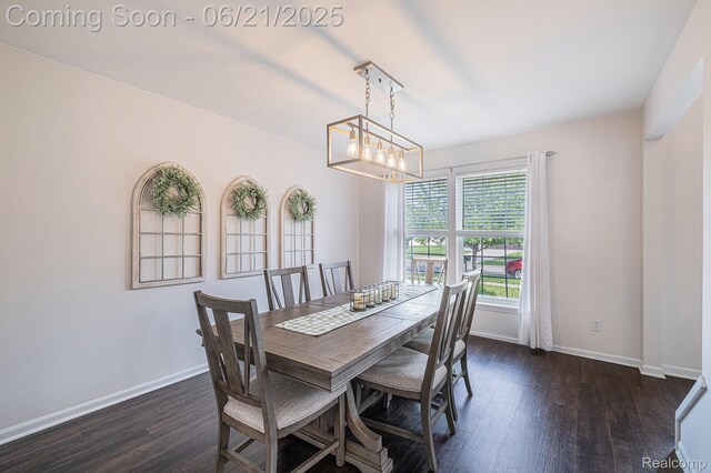 894 Canyon Creek Dr, Holly, MI 48442 - dining room featuring dark wood-type flooring and a chandelier