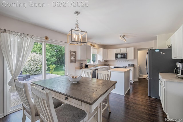 894 Canyon Creek Dr, Holly, MI 48442 - dining area with a chandelier, dark wood-type flooring, and recessed lighting