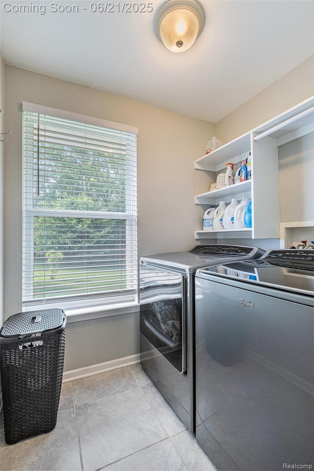 894 Canyon Creek Dr, Holly, MI 48442 - laundry room featuring separate washer and dryer, healthy amount of natural light, and light tile patterned floors