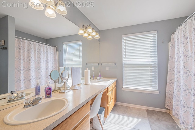 894 Canyon Creek Dr, Holly, MI 48442 - full bath with double vanity, a chandelier, and tile patterned floors
