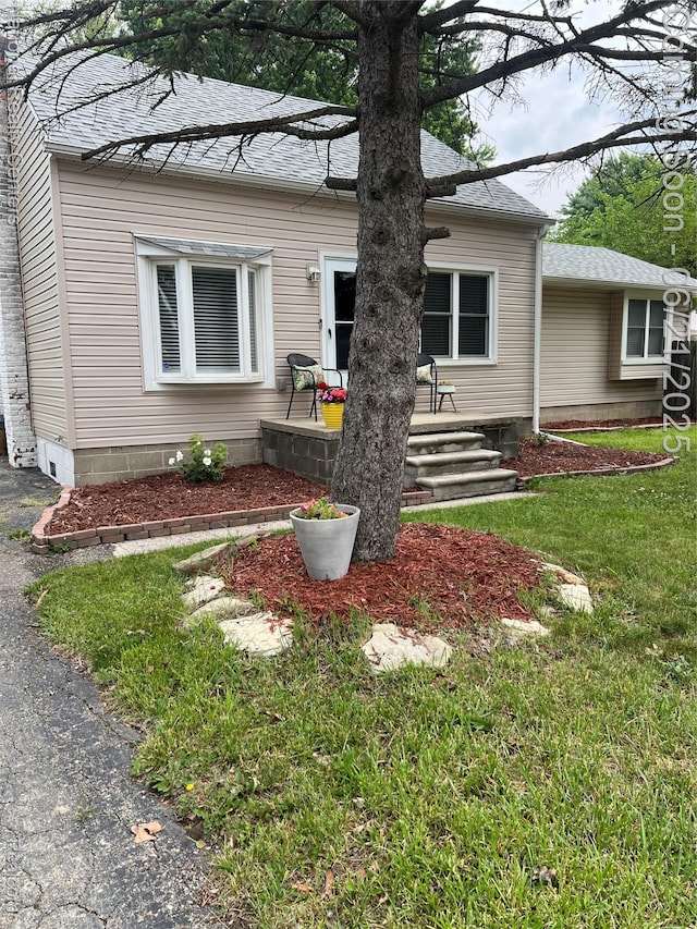 13203 Frazho Rd, Warren, MI 48089 - view of front of property with roof with shingles and a front yard