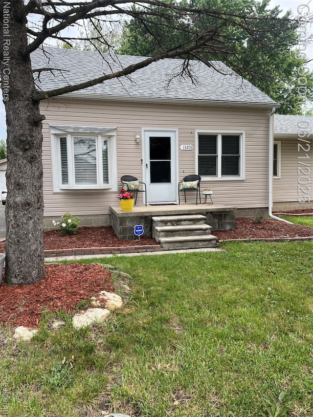13203 Frazho Rd, Warren, MI 48089 - view of front of property featuring a front lawn and a shingled roof