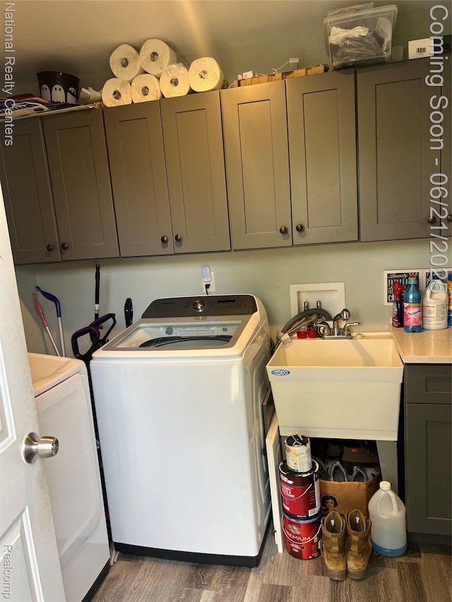 13203 Frazho Rd, Warren, MI 48089 - washroom with separate washer and dryer, wood finished floors, and cabinet space