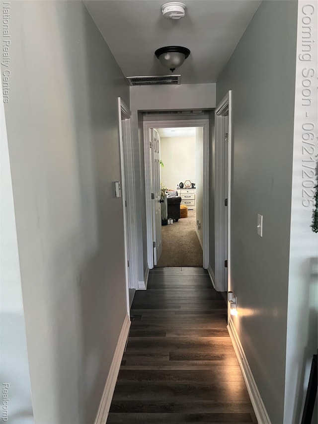 13203 Frazho Rd, Warren, MI 48089 - hall featuring dark wood-style flooring and baseboards
