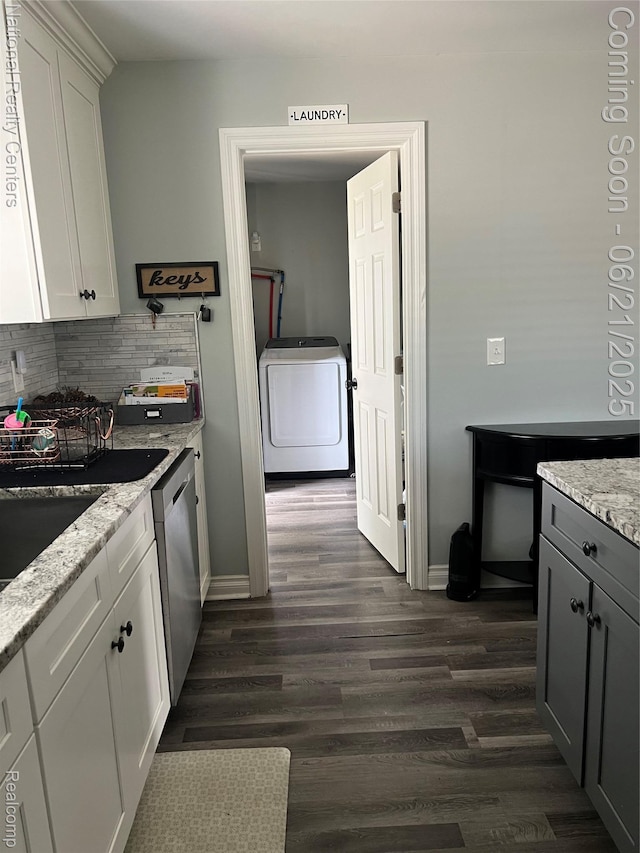 13203 Frazho Rd, Warren, MI 48089 - kitchen featuring washer / dryer, stainless steel dishwasher, backsplash, dark wood finished floors, and white cabinets