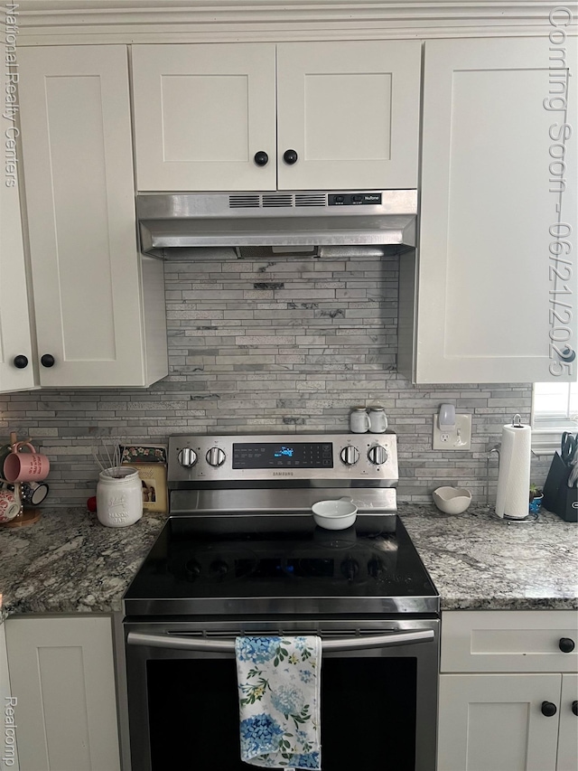 13203 Frazho Rd, Warren, MI 48089 - kitchen featuring stainless steel range with electric cooktop, under cabinet range hood, backsplash, white cabinets, and light stone countertops