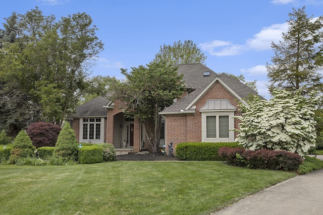 5448 Waterfield Ct, Ann Arbor, MI 48108 - view of front of property featuring a front lawn, brick siding, and roof with shingles