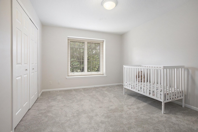 5448 Waterfield Ct, Ann Arbor, MI 48108 - unfurnished bedroom with carpet, a closet, and a crib