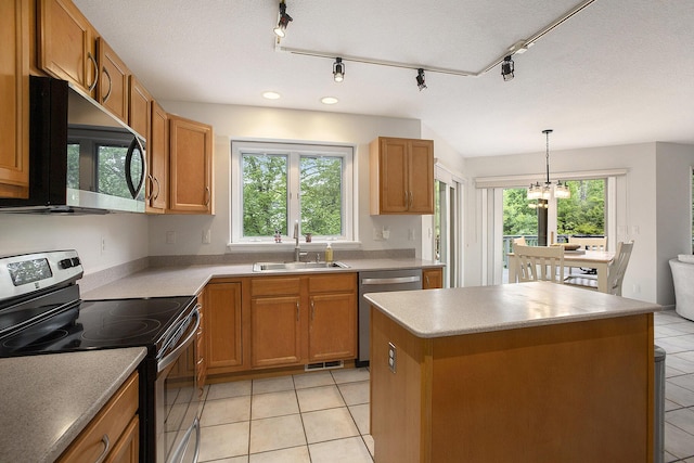 5448 Waterfield Ct, Ann Arbor, MI 48108 - kitchen with stainless steel appliances, light tile patterned flooring, and plenty of natural light