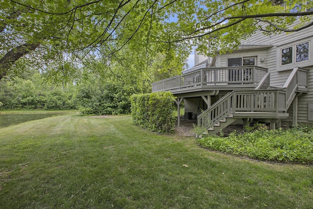 5448 Waterfield Ct, Ann Arbor, MI 48108 - view of green lawn featuring stairway and a deck with water view