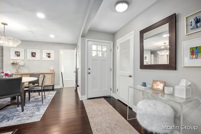 2243 Cambridge Dr SE, Grand Rapids, MI 49506 - entrance foyer with a chandelier, dark wood-style flooring, and recessed lighting