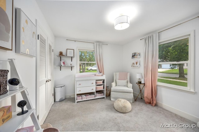 2243 Cambridge Dr SE, Grand Rapids, MI 49506 - living area with carpet and baseboards