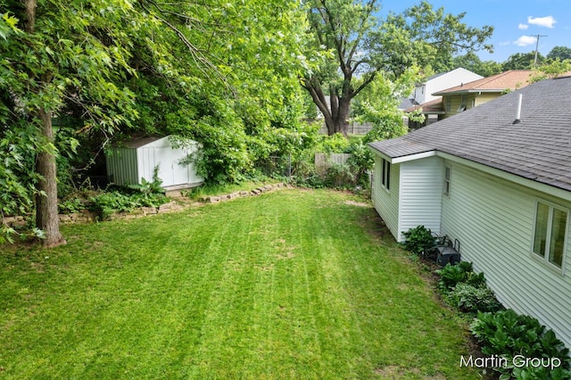 2243 Cambridge Dr SE, Grand Rapids, MI 49506 - view of yard with a storage shed