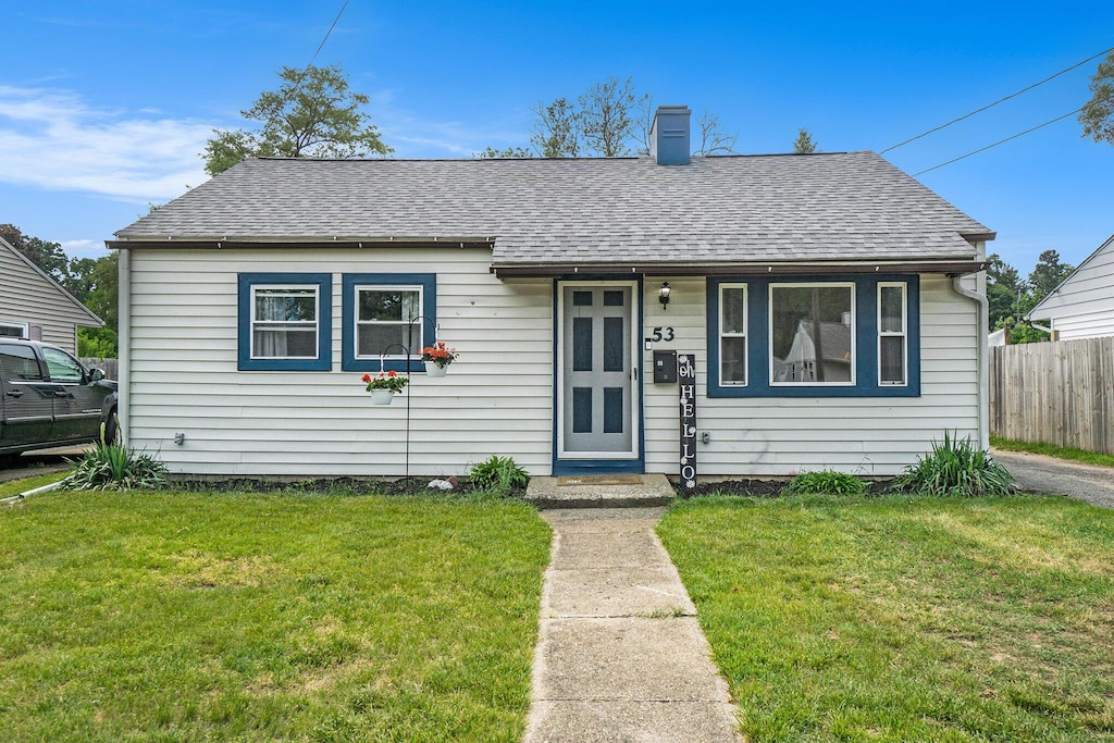 53 N Mason Ave, Battle Creek, MI 49037 - bungalow-style house with a chimney and a shingled roof