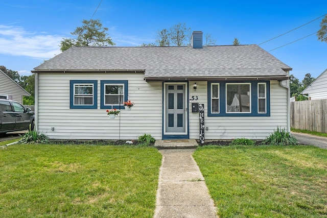 53 N Mason Ave, Battle Creek, MI 49037 - bungalow-style house with a chimney and a shingled roof