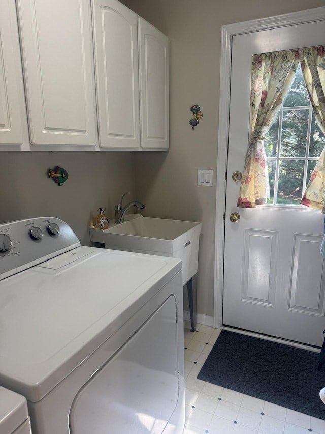 6927 Plum Hollow Cir, Kalamazoo, MI 49009 - laundry room with independent washer and dryer and cabinet space