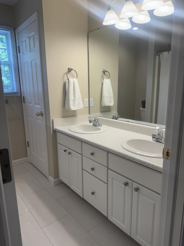 6927 Plum Hollow Cir, Kalamazoo, MI 49009 - bathroom with double vanity and tile patterned flooring