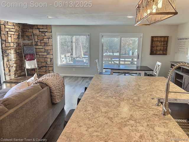 8811 Coyle Dr, Pinckney, MI 48169 - kitchen with dark wood-type flooring, recessed lighting, and open floor plan