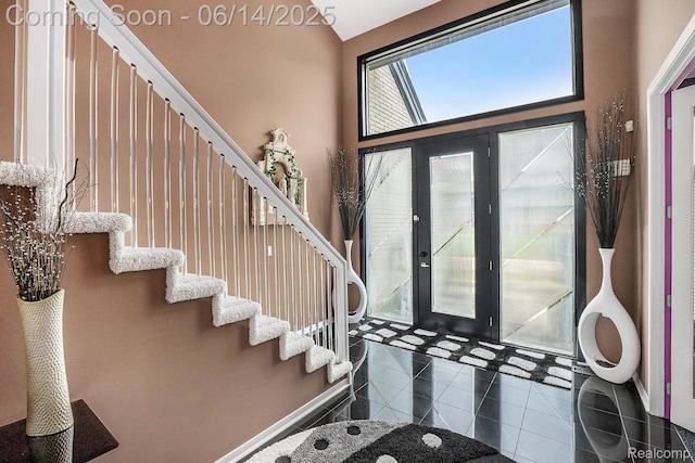 4322 Darlene Dr, Commerce Twp, MI 48382 - foyer entrance featuring tile patterned floors and stairs