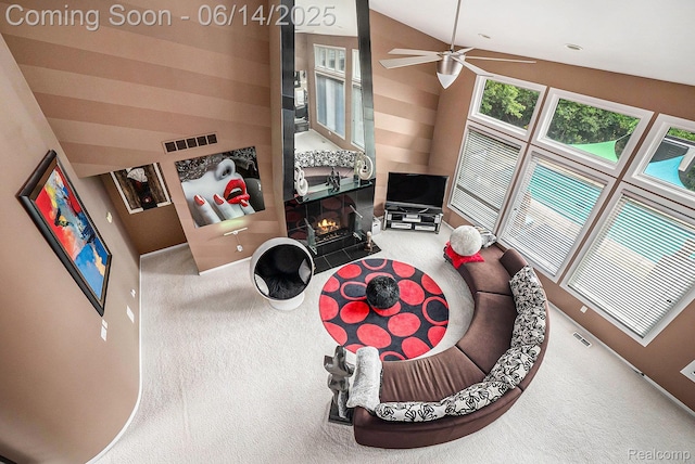 4322 Darlene Dr, Commerce Twp, MI 48382 - living area featuring carpet, lofted ceiling, ceiling fan, and a tile fireplace