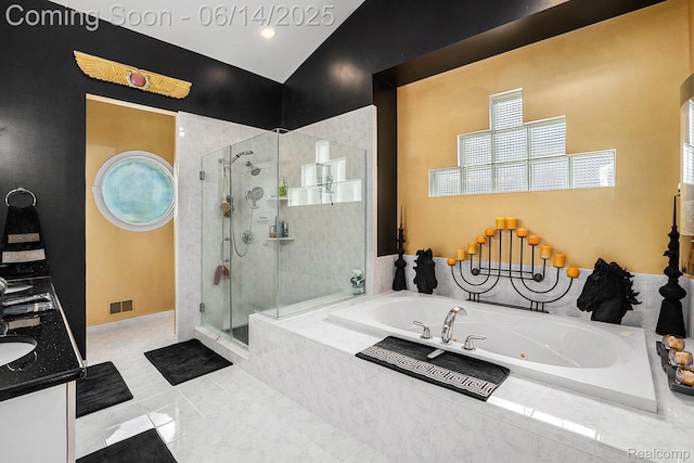 4322 Darlene Dr, Commerce Twp, MI 48382 - bathroom with a tub with jets, a stall shower, and double vanity