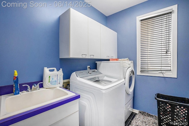4322 Darlene Dr, Commerce Twp, MI 48382 - laundry room featuring cabinet space, separate washer and dryer, and tile patterned floors