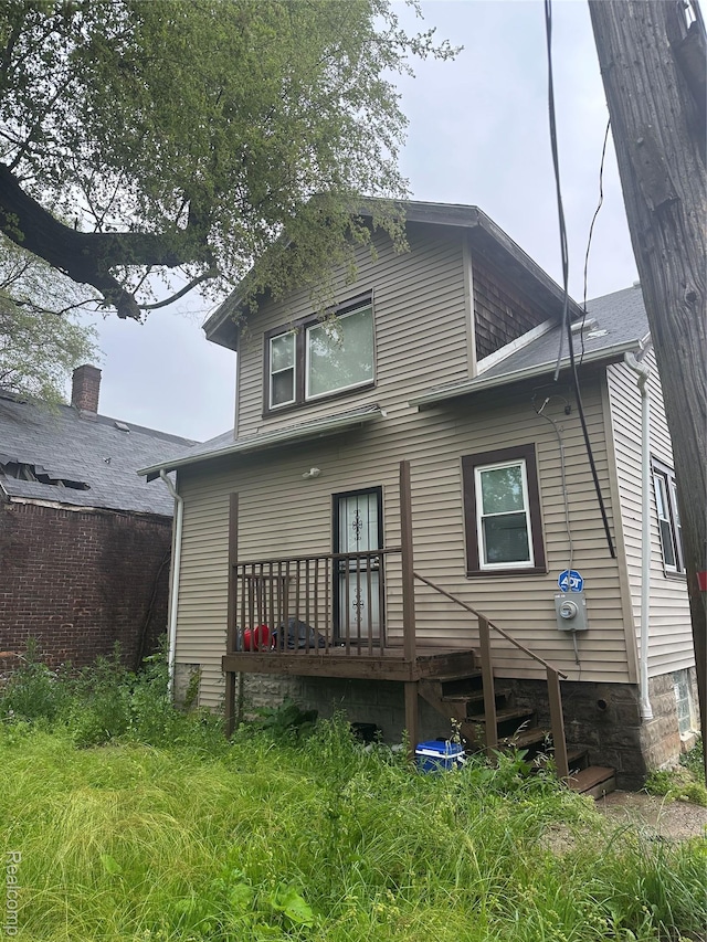 19131 Cliff St, Detroit, MI 48234 - rear view of house featuring a wooden deck