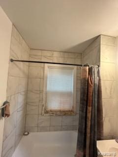 19131 Cliff St, Detroit, MI 48234 - bathroom featuring shower / tub combo with curtain